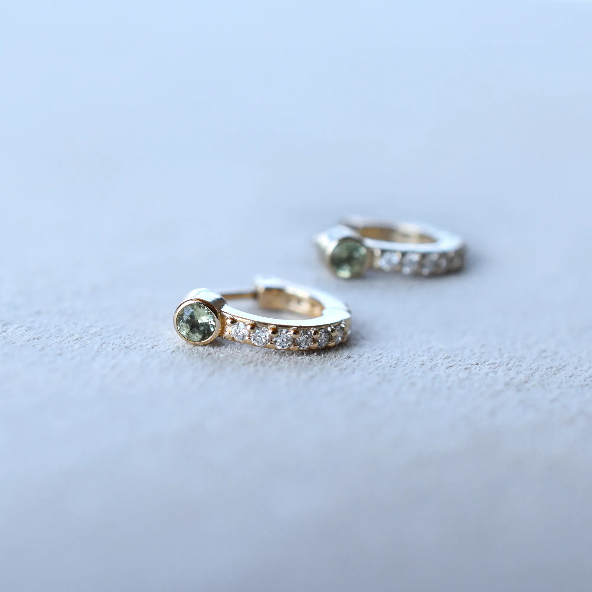 Tiny Peridot Huggie Hoops with Diamonds in 14k Gold (August) - Image 6