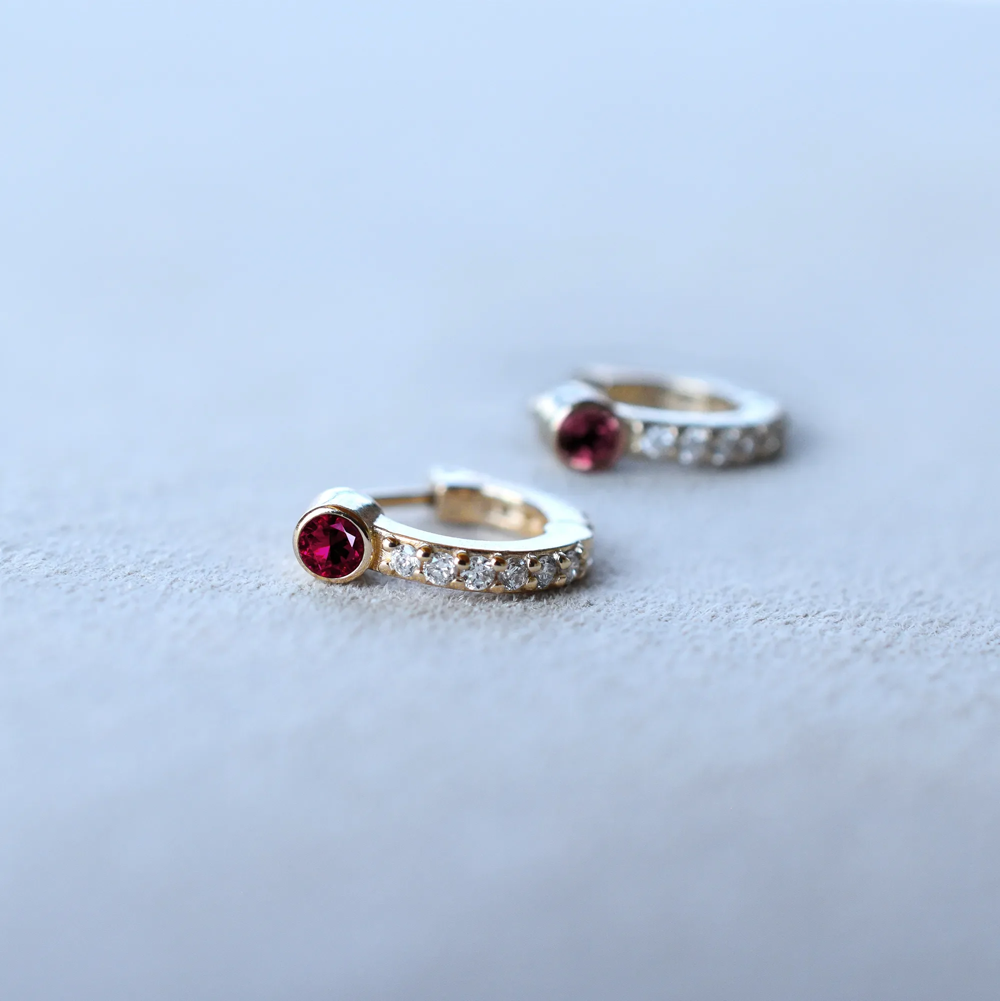 Tiny Ruby Huggie Hoops with Diamonds in 14k Gold (July) - Image 6